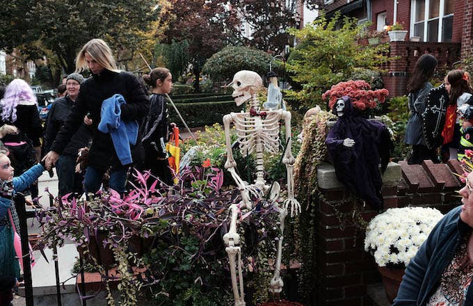 People trick or treat in a Brooklyn neighborhood on Halloween night.