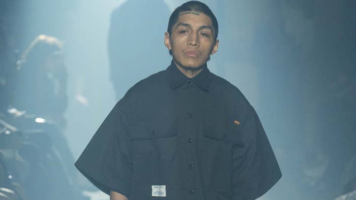 A model is seen wearing Dickies pieces for a show