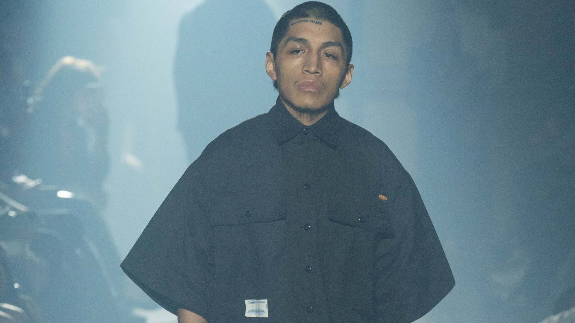 A model is seen wearing Dickies pieces for a show