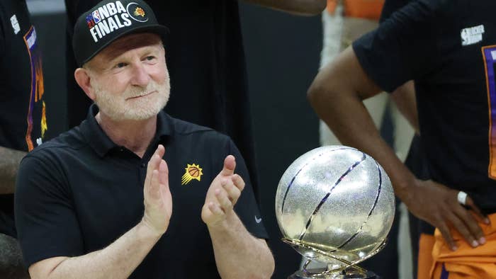 Robert Sarver is pictured clapping at an event