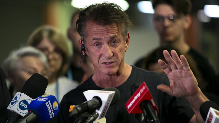 Sean Penn is pictured speaking with reporters