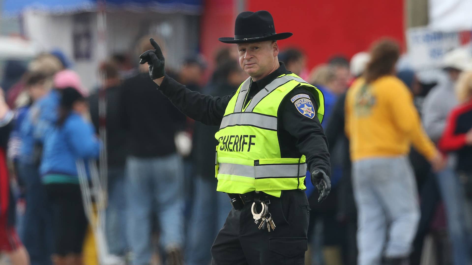 A sheriff directs traffic outside the stadium before the Buffalo Bills NFL game