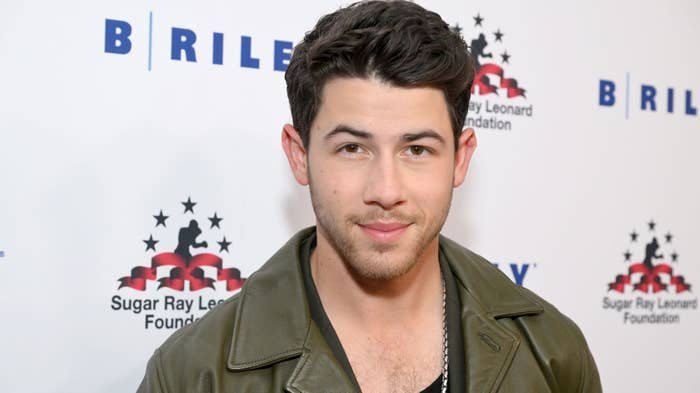 Nick Jonas poses for a photo in 2022