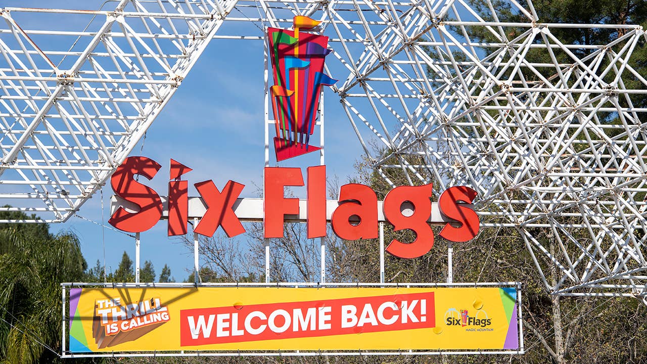 A sign at the entrance of the theme park Six Flags Magic Mountain welcomes the public back on the day of the park's re-opening