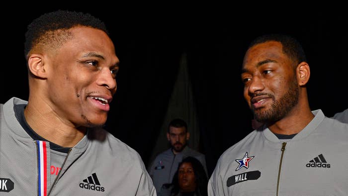 Russell Westbrook #0 of the Western Conference All Star Team talks to John Wall.