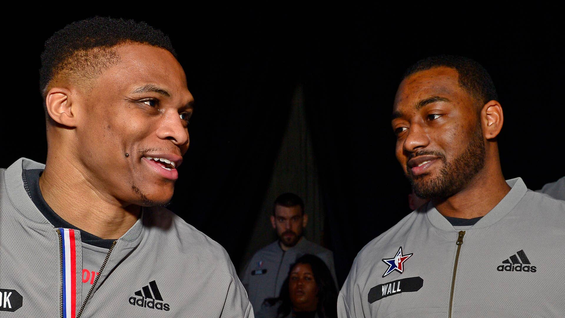 Russell Westbrook #0 of the Western Conference All Star Team talks to John Wall.