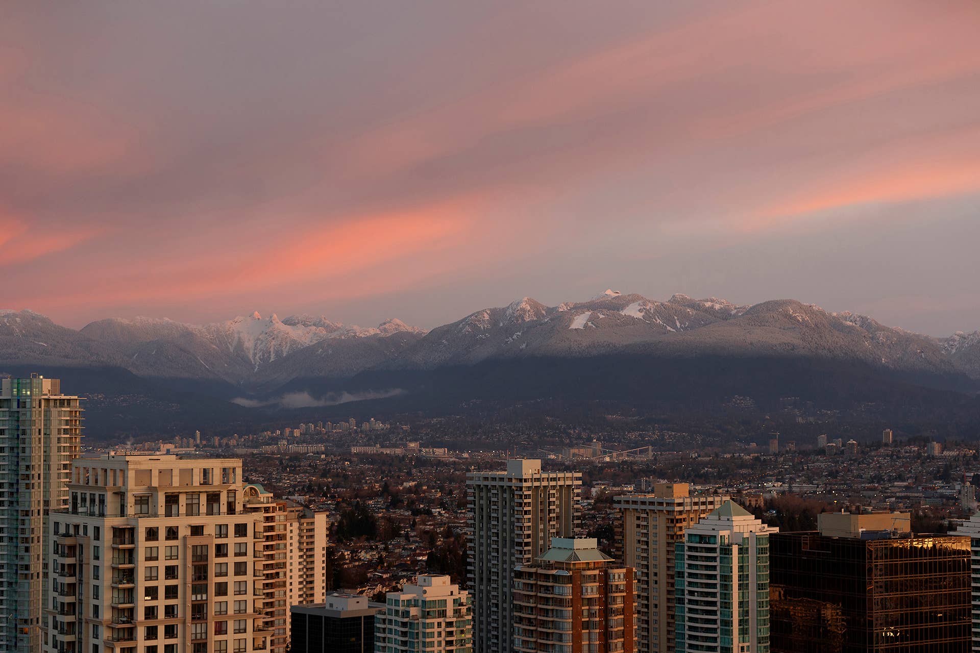 A sunset displays over the cityscape of Vancouver.