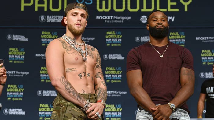 Jake Paul and Tyron Woodley pose during a press conference.