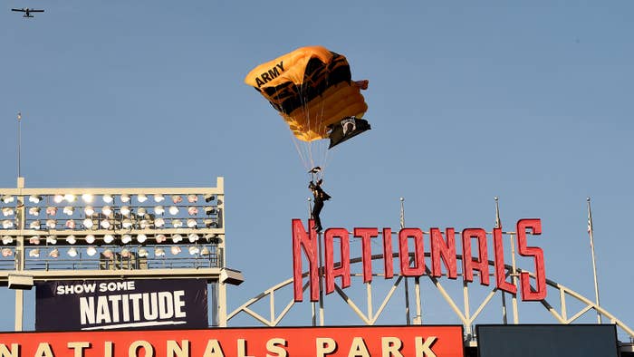 A member of the US Army Parachute Team lands at Nationals Park.