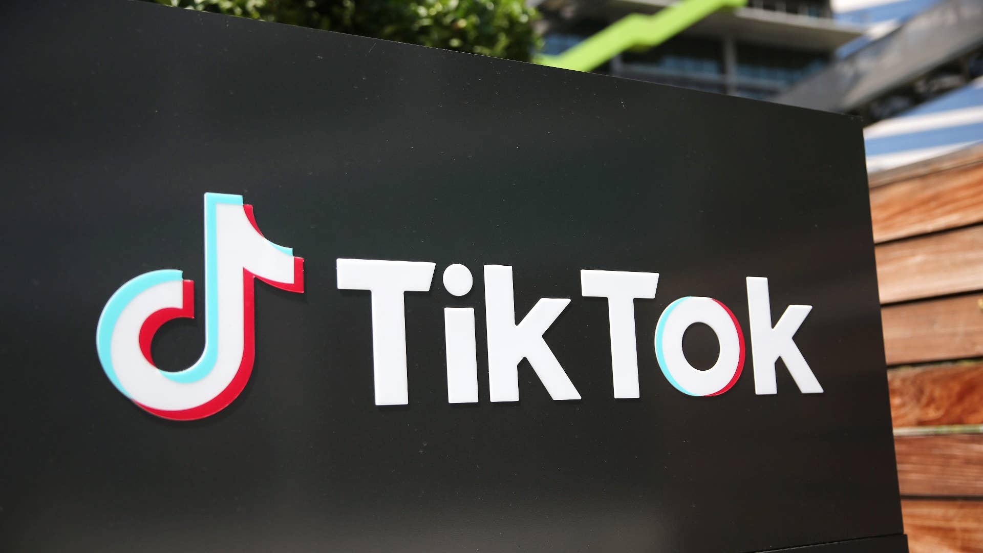 The TikTok logo is displayed outside a TikTok office.