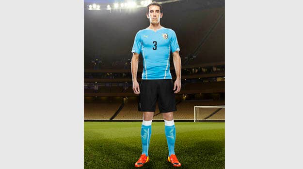 Diego Godín in the 2014 Uruguay Home Kit that features PUMA's PWR ACTV Technology