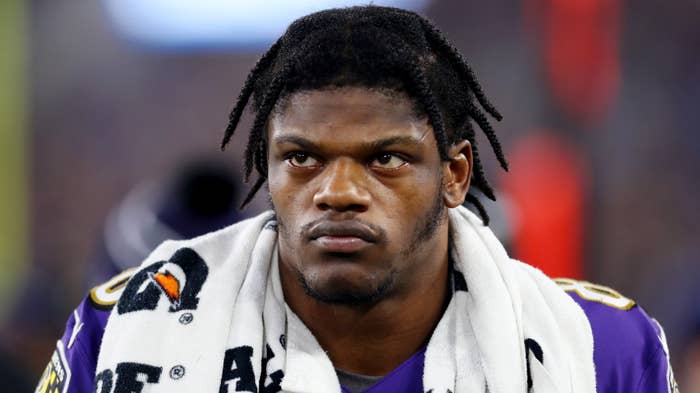 Lamar Jackson looks on during NFL playoff game.