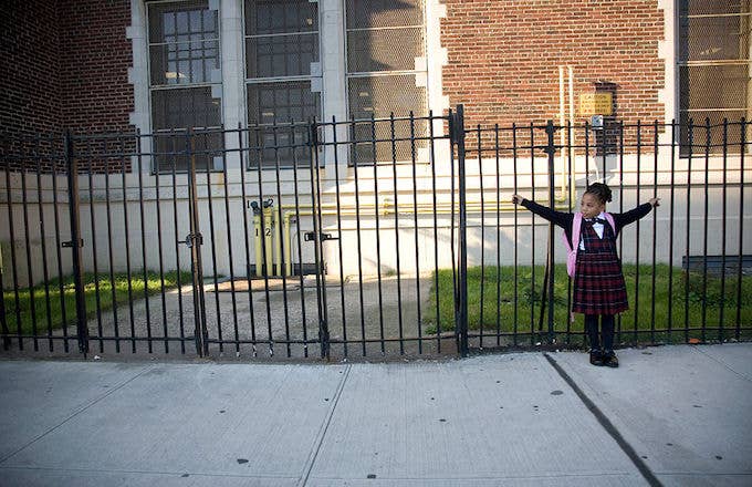 A child waiting outside a Bronx Public School in 2007.
