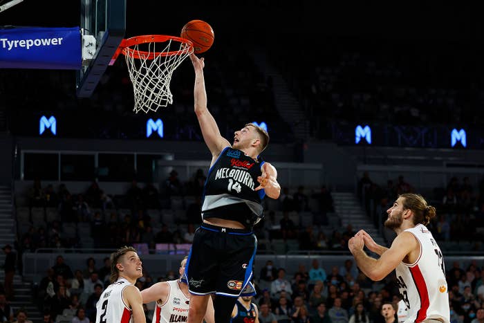 NBL player Jack White drives to the basket for Melbourne United