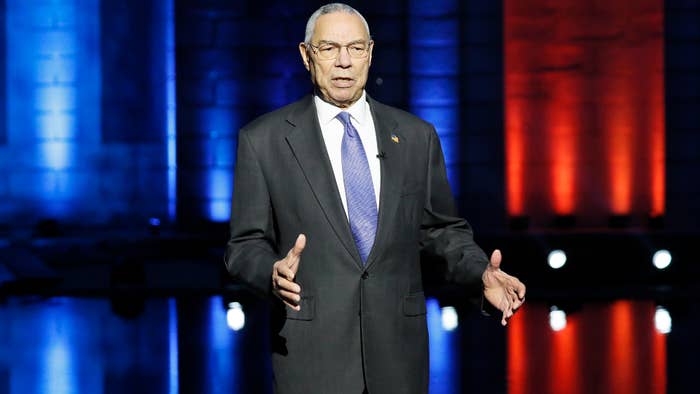 Colin Powell is seen on a stage.