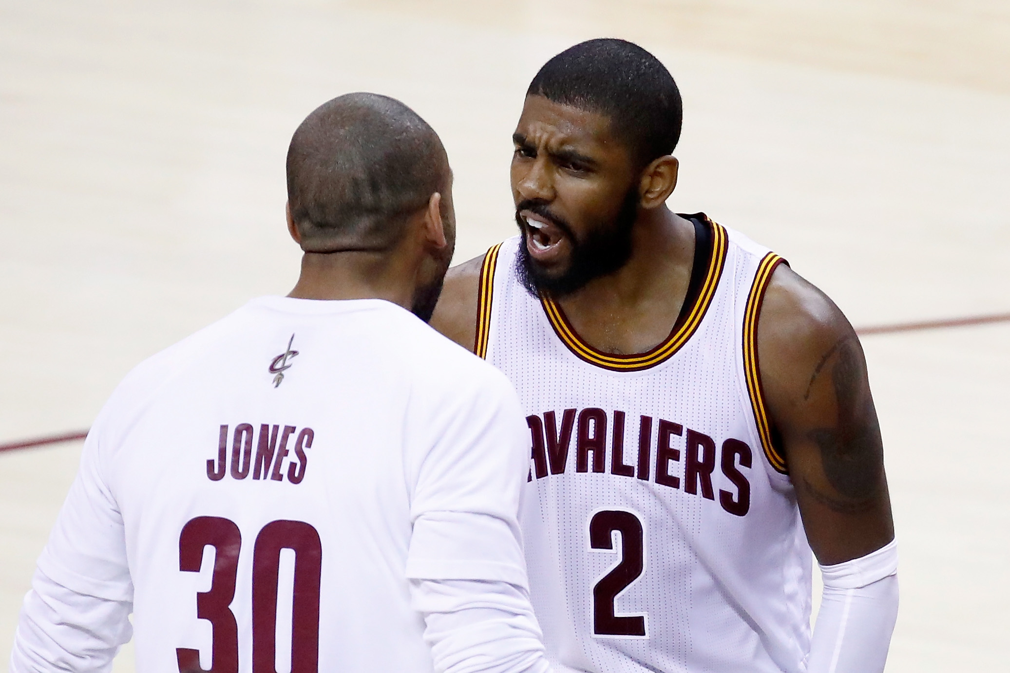 Kyrie Irving yells at one of his Cavs teammates.