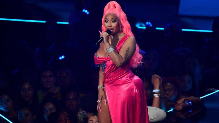 Nicki Minaj is seen speaking into the mic