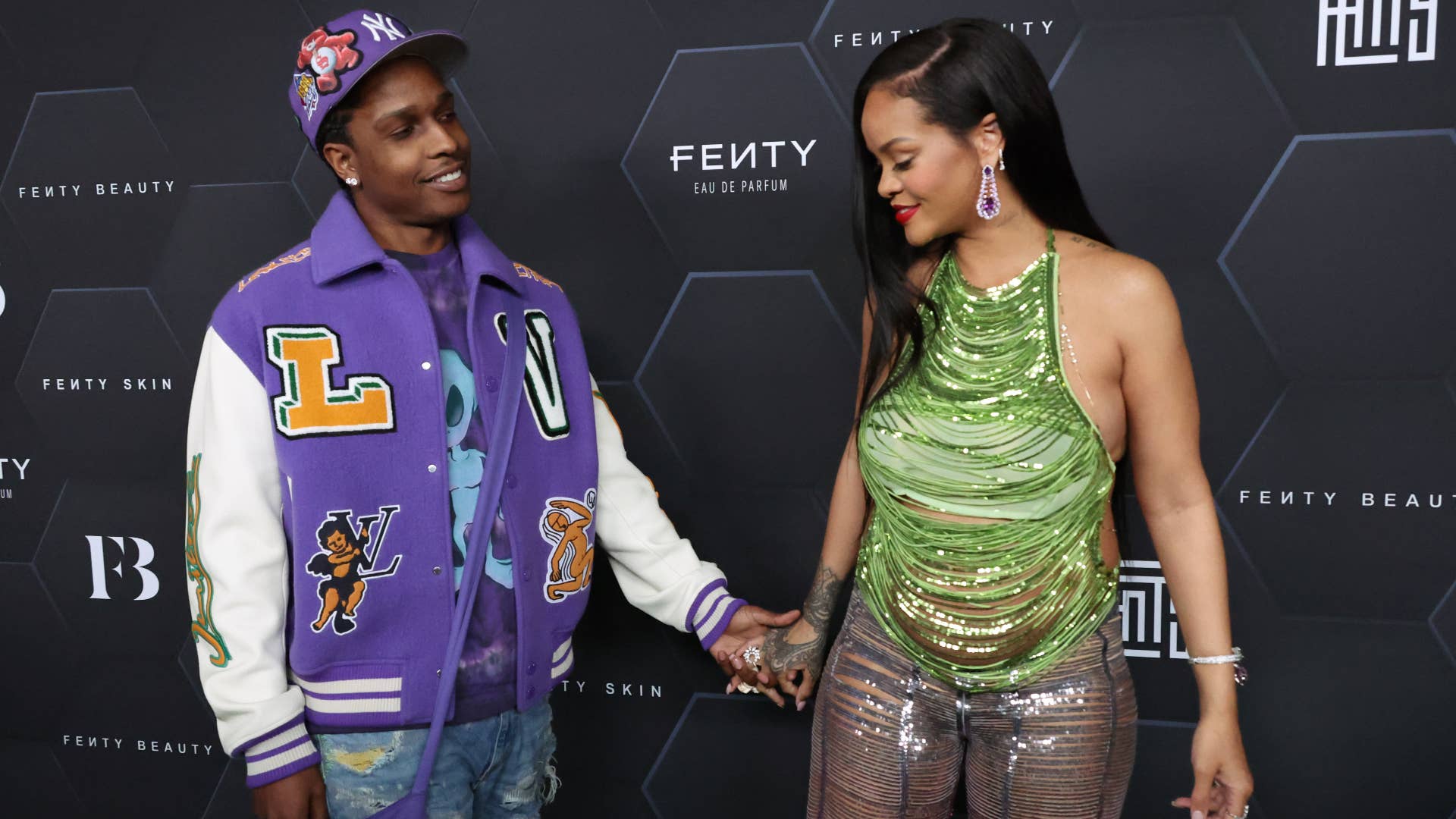 ASAP Rock and Rihanna are pictured at a Fenty event