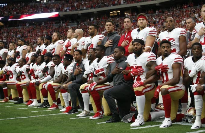 49ers players kneel during the national anthem.