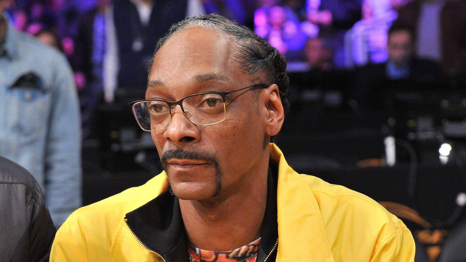 Snoop Dogg attends a basketball game