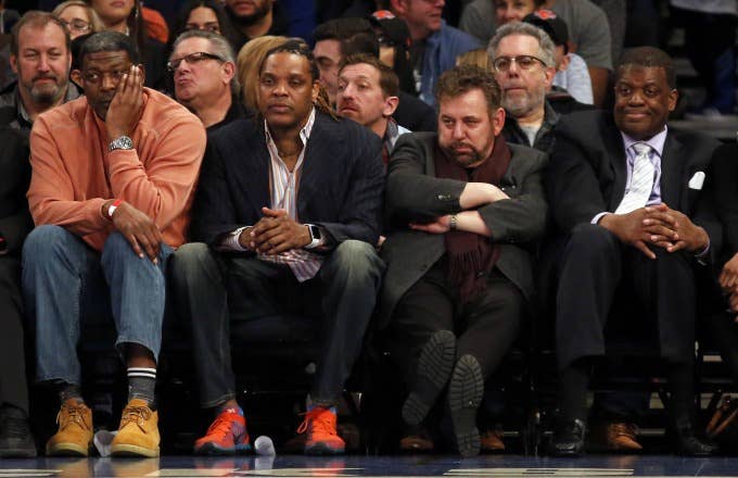 James Dolan sits with former Knicks stars.