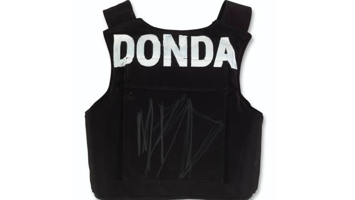 A Donda vest is shown with an MBD engraving.