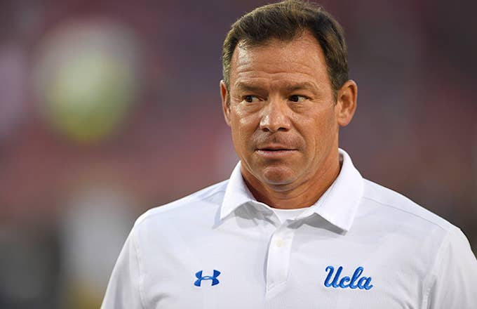 Jim Mora watches warmups before game against Stanford.