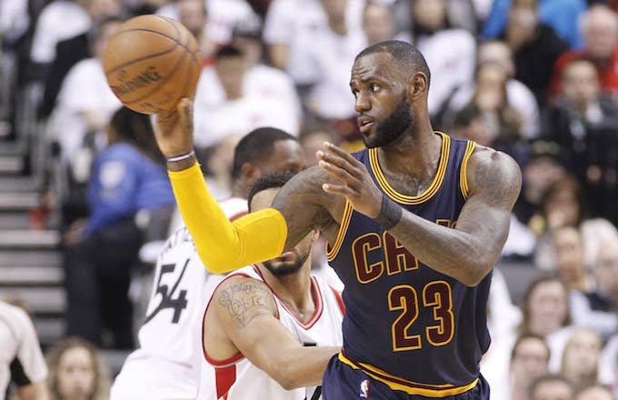 LeBron James passing off to teammate during game.