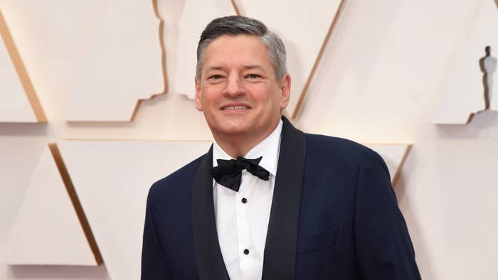 Ted Sarandos poses for photo on Oscars red carpet.