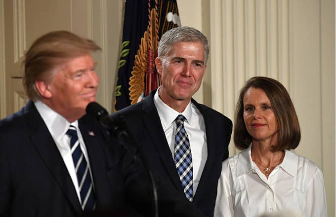 Judge Neil Gorsuch (C) and his wife  listen after Donald Trump nominated him for the Supreme Court