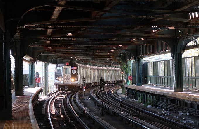 A train pulls into an NY subway station.