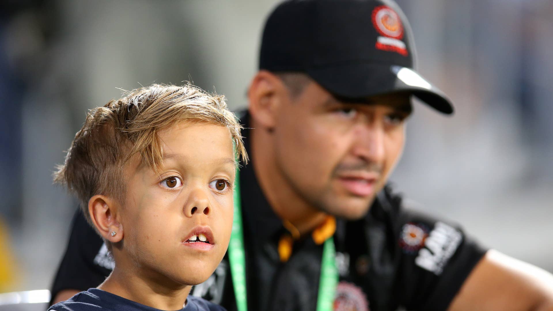 Quaden Bayles looks on with Cody Walker of the Indigenous All Stars