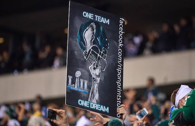 Philadelphia Eagles fan celebrates by holding up a sign during the NFC Championship Game.