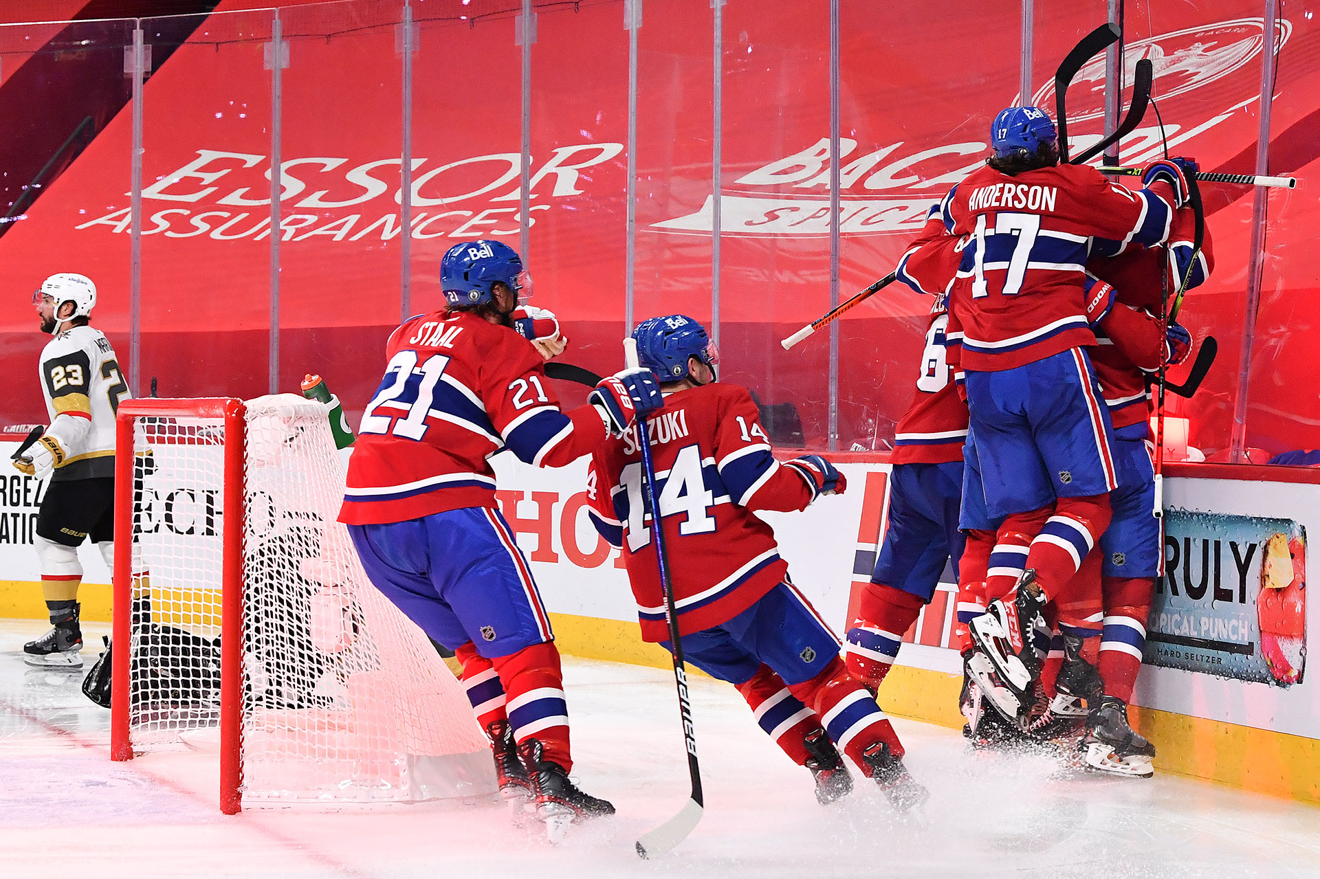 Artturi Lehkonen #62 of the Montreal Canadiens is congratulated by his teammates after scoring