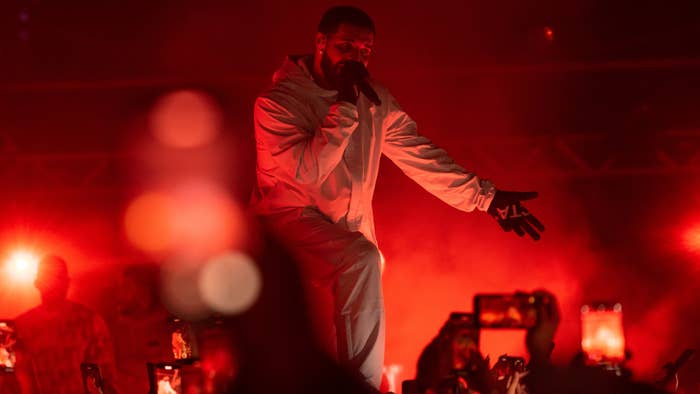 Drake is seen performing music for fans