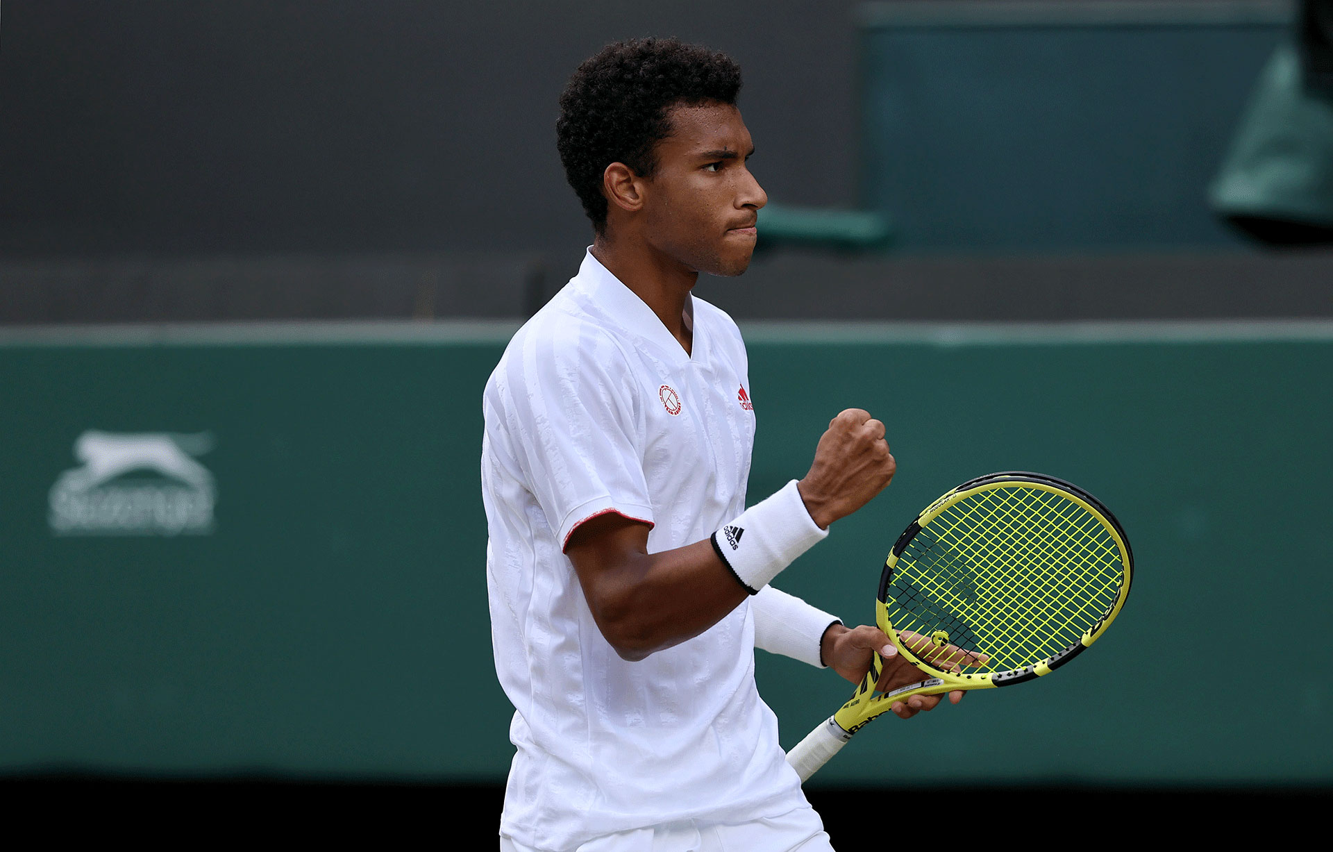 Felix Auger Aliassime of Canada celebrates during his men&#x27;s Singles Quarter Final match against Matteo Berrettini of Italy on Day Nine of The Championships - Wimbledon 2021 at All England Lawn Tennis and Croquet Club on July 07, 2021 in London, England.