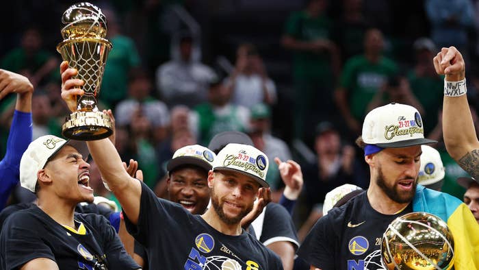 NBA - Stephen Curry receives the Bill Russell Trophy as