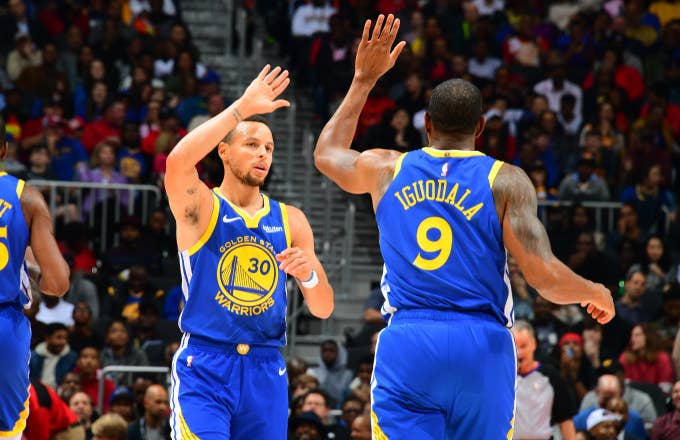 Stephen Curry #30 and Andre Iguodala #9 of the Golden State Warriors celebrates
