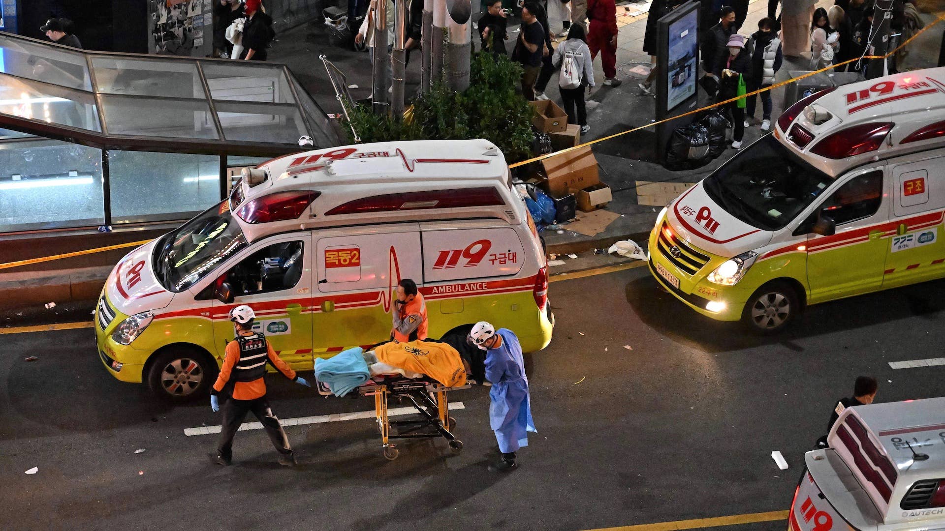The body of a victim of cardiac arrest is transported in the popular nightlife district of Itaewon