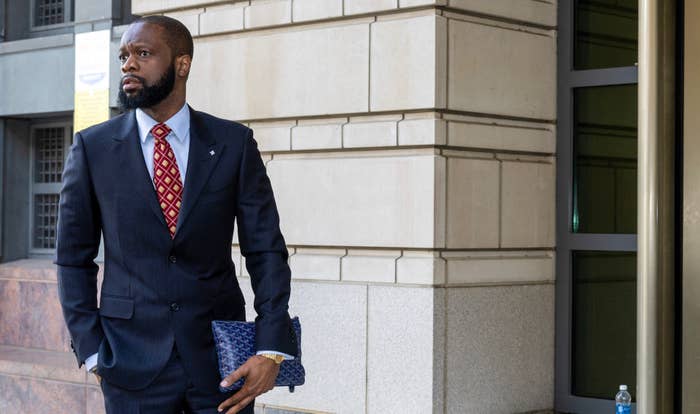 Fugees rapper Pras enters D.C. courthouse