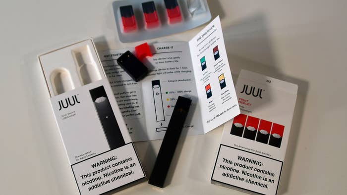 An illustration shows the contents of an electronic Juul cigarette box