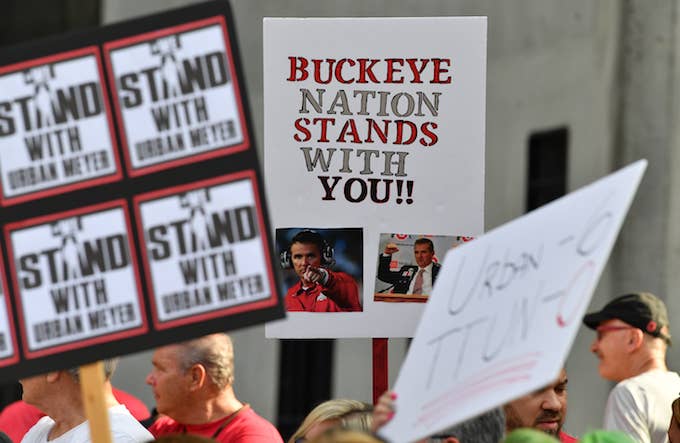 Supporters of Ohio State head football coach Urban Meyer.