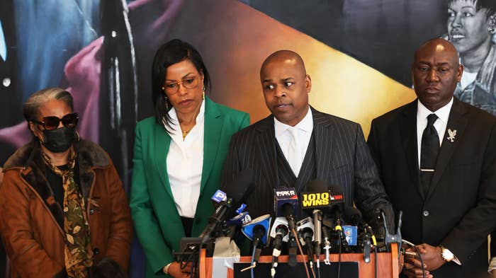 This is a photo of Malcolm X&#x27;s family on the right and Civil Rights Attorney Ben Crump on the left