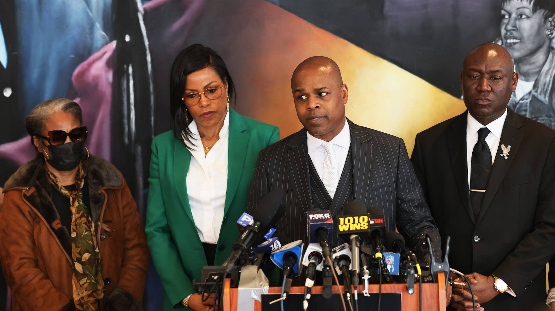 This is a photo of Malcolm X's family on the right and Civil Rights Attorney Ben Crump on the left