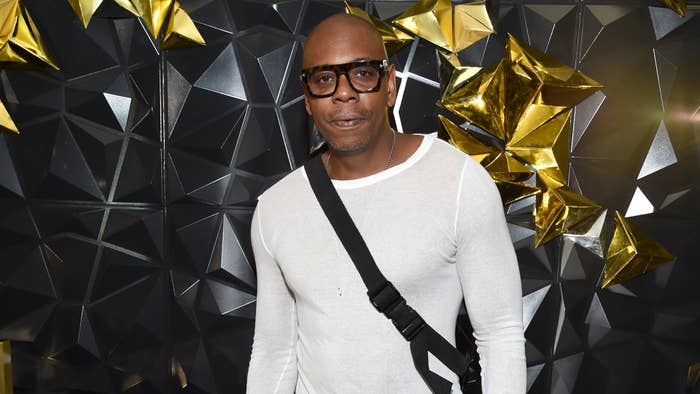 Comedian Dave Chappelle attends a Netflix event and poses for a photo.