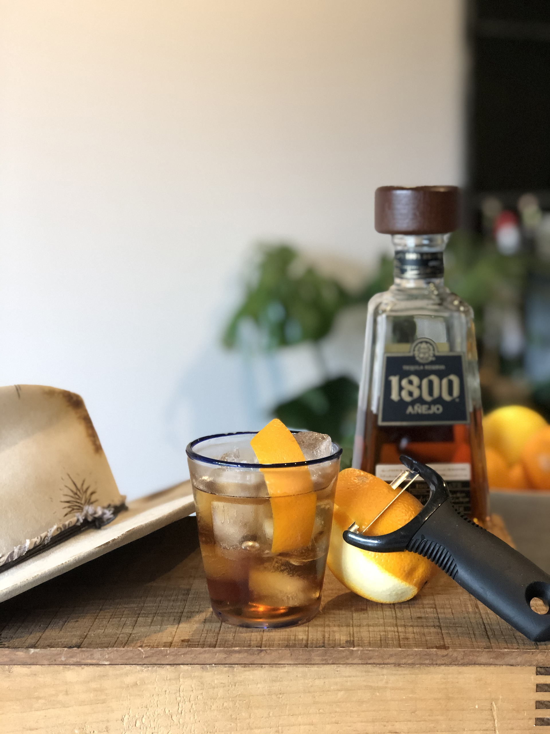 1800 Anejo alongside an Old Fashioned cocktail