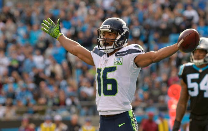 Tyler Lockett #16 of the Seattle Seahawks celebrates a touchdown against the Carolina Panthers