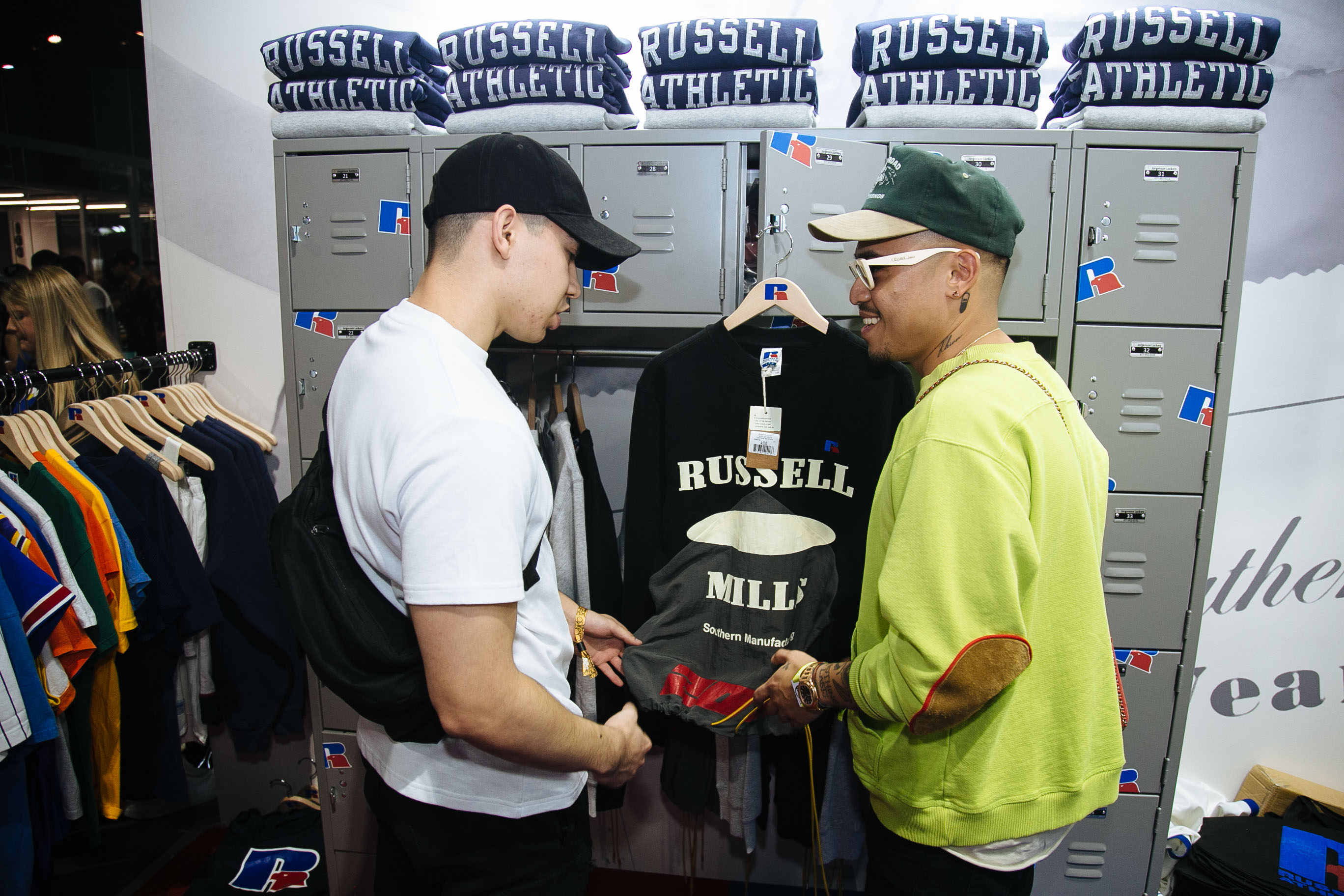 Rhuigi at Russell Athletic Booth With Fan