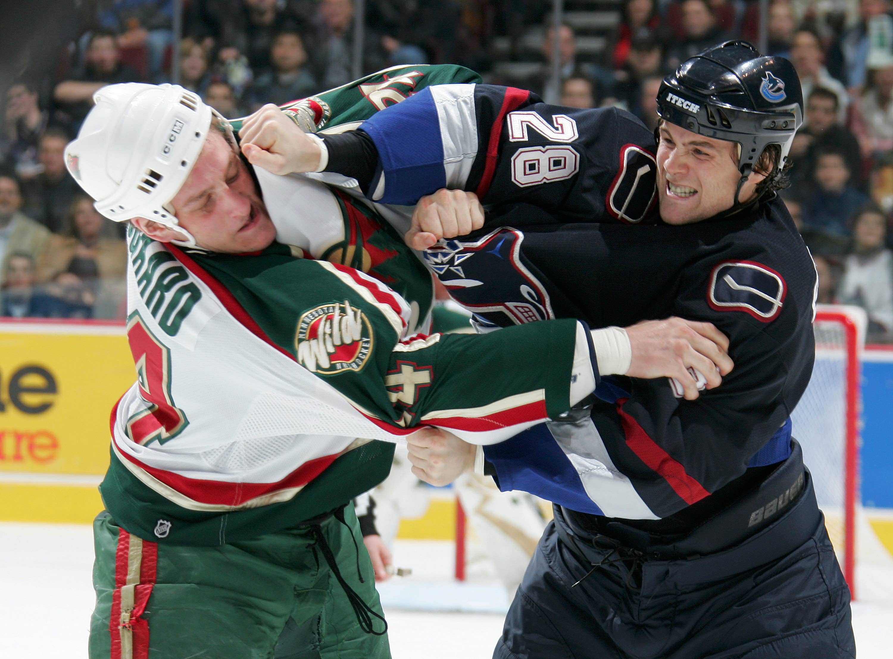 NHL enforcers fighting during a game