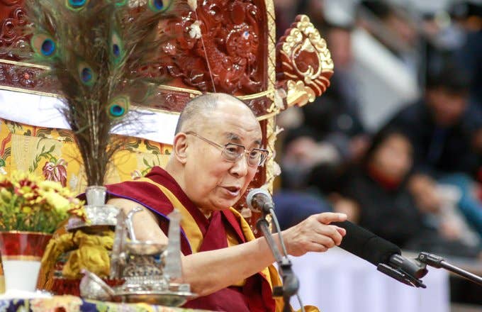 Dalai Lama speaks to worshippers during ceremonies at the Buyant Ukhaa sports stadium in Ulan Bator